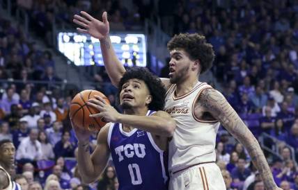 Mar 1, 2023; Fort Worth, Texas, USA;  TCU Horned Frogs guard Micah Peavy (0) shoots past Texas Longhorns forward Timmy Allen (0) during the first half at Ed and Rae Schollmaier Arena. Mandatory Credit: Kevin Jairaj-USA TODAY Sports