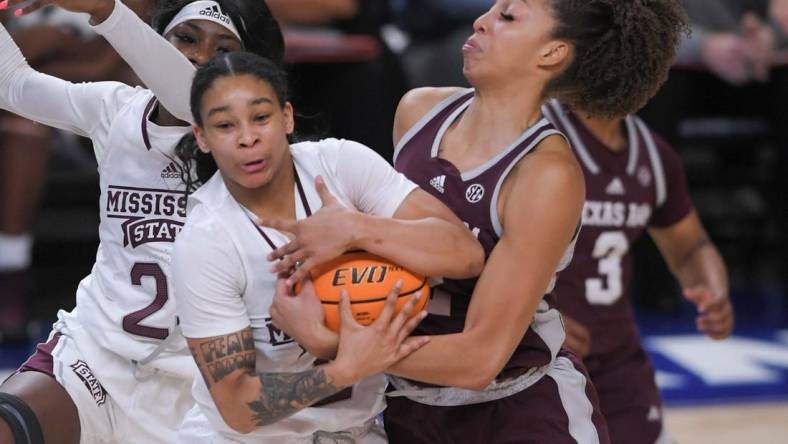 Mississippi State forward Ramani Parker (23) and Texas A&M forward Jada Malone (13) reach for a ball during the first quarter of the SEC Women's Basketball Tournament at Bon Secours Wellness Arena in Greenville, S.C. Thursday, March 2, 2023.

Texas A M Vs Mississippi State 2023 Sec Women S Basketball Tournament In Greenville Sc