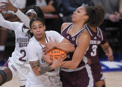 Mississippi State forward Ramani Parker (23) and Texas A&M forward Jada Malone (13) reach for a ball during the first quarter of the SEC Women's Basketball Tournament at Bon Secours Wellness Arena in Greenville, S.C. Thursday, March 2, 2023.

Texas A M Vs Mississippi State 2023 Sec Women S Basketball Tournament In Greenville Sc