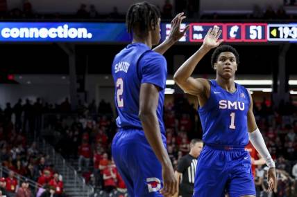 Mar 5, 2023; Cincinnati, Ohio, USA;  Southern Methodist Mustangs guard Zhuric Phelps (1) high-fives guard Jalen Smith (2) during a stop in play against the Cincinnati Bearcats in the second half at Fifth Third Arena. Mandatory Credit: Aaron Doster-USA TODAY Sports