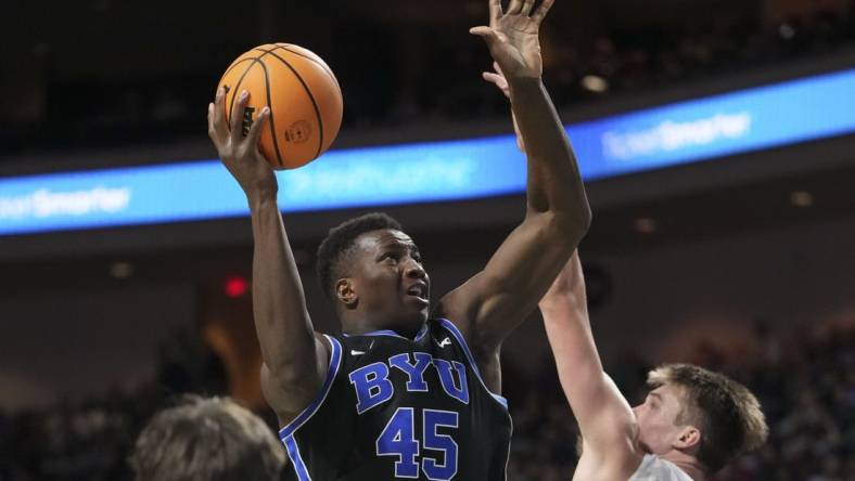 March 6, 2023; Las Vegas, NV, USA; Brigham Young Cougars forward Fousseyni Traore (45) shoots the basketball against Saint Mary's Gaels center Mitchell Saxen (11) during the second half in the semifinals of the WCC Basketball Championships at Orleans Arena. Mandatory Credit: Kyle Terada-USA TODAY Sports