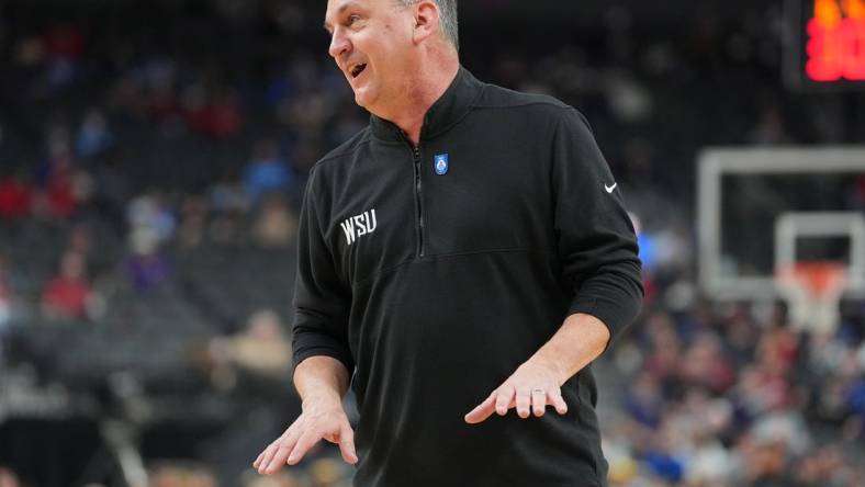 Mar 8, 2023; Las Vegas, NV, USA; Washington State Cougars head coach Kyle Smith talks to an official before a free throw attempt by the California Golden Bears during the first half at T-Mobile Arena. Mandatory Credit: Stephen R. Sylvanie-USA TODAY Sports