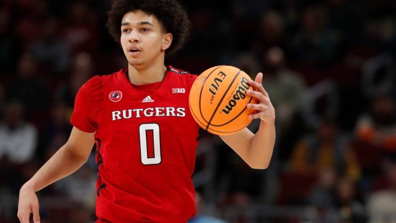 Rutgers Scarlet Knights guard Derek Simpson (0) drives to the basket during the Big Ten Men   s Basketball Tournament game against the Purdue Boilermakers, Friday, March 10, 2023, at United Center in Chicago. Purdue Boilermakers won 70-65.

Purrut031023 Am14298