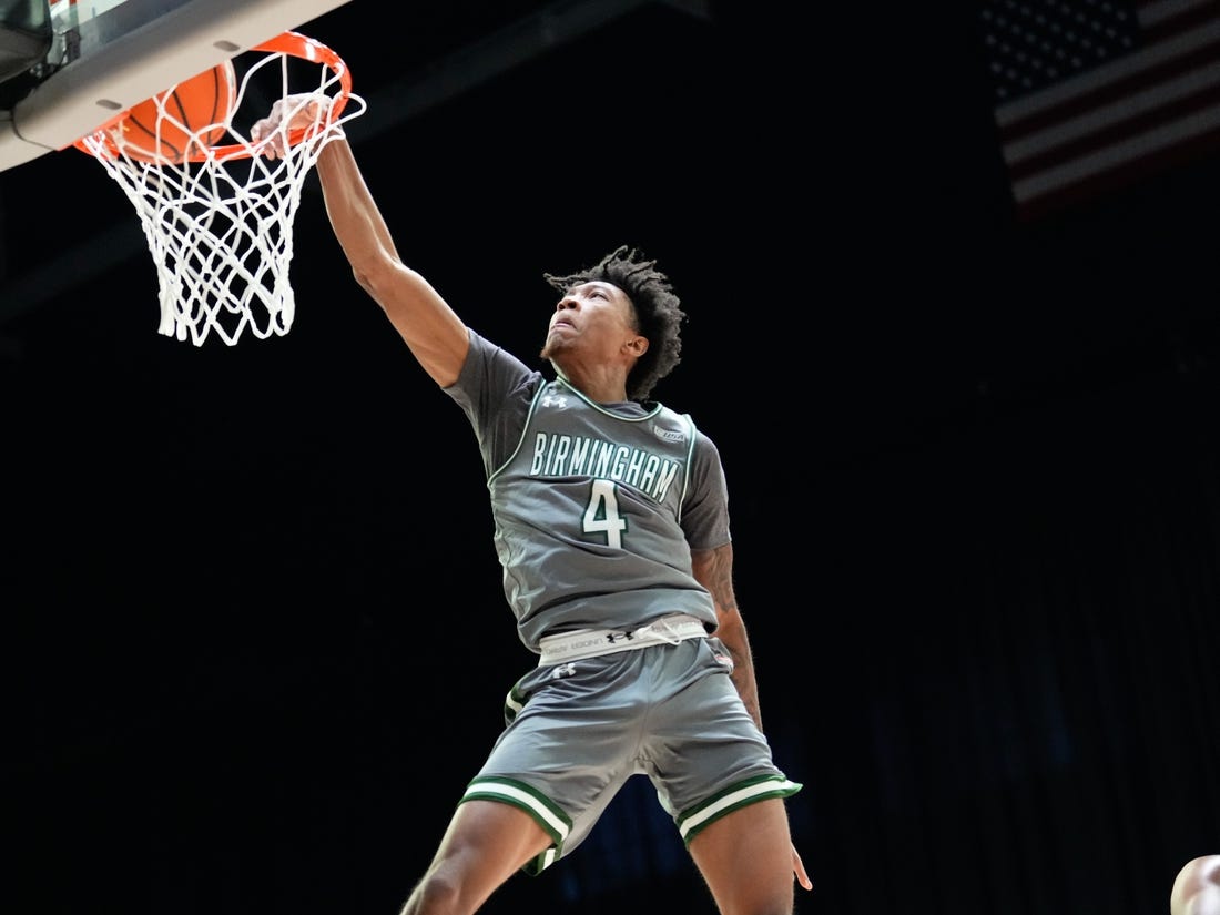 Mar 10, 2023; Frisco, TX, USA;  UAB Blazers guard Eric Gaines (4) dunks the ball against the North Texas Mean Green during the first half at Ford Center at The Star. Mandatory Credit: Chris Jones-USA TODAY Sports