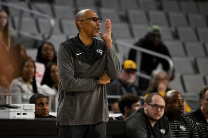 Mar 10, 2023; Fort Worth, TX, USA; UCF Knights head coach Johnny Dawkins talks to his players during the first half of the game against the Memphis Tigers at Dickies Arena. Mandatory Credit: Jerome Miron-USA TODAY Sports