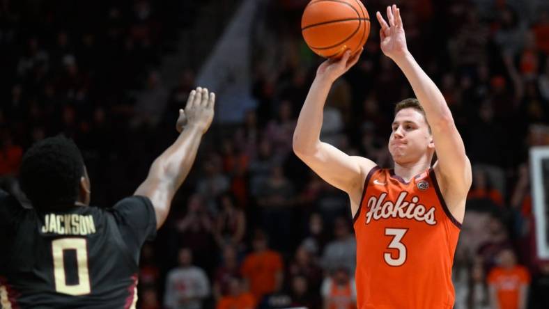 Mar 4, 2023; Blacksburg, Virginia, USA; Virginia Tech Hokies guard Sean Pedulla (3) shoots over Florida State Seminoles guard Chandler Jackson (0) at Cassell Coliseum. Mandatory Credit: Lee Luther Jr.-USA TODAY Sports