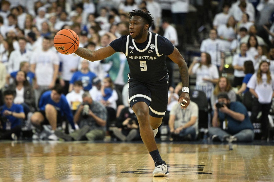 Mar 1, 2023; Omaha, Nebraska, USA;  Georgetown Hoyas guard Jay Heath (5) dribbles against the Creighton Bluejays in the first half at CHI Health Center Omaha. Mandatory Credit: Steven Branscombe-USA TODAY Sports