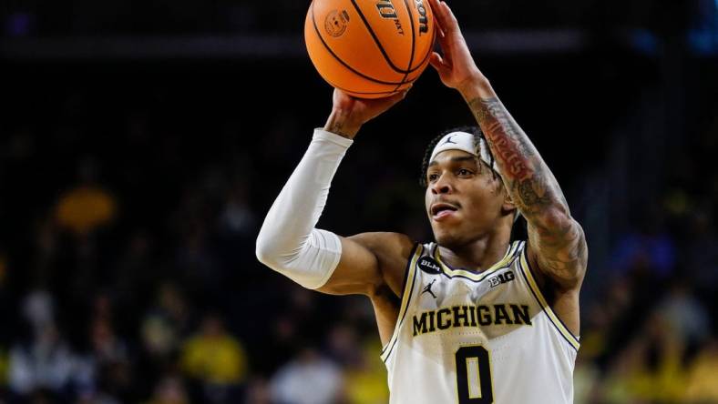 Michigan guard Dug McDaniel (0) makes a pass against Toledo during the first half of the first round of the NIT at Crisler Center in Ann Arbor on Tuesday, March 14, 2023.