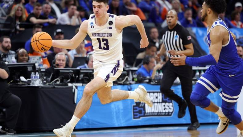 Mar 16, 2023; Sacramento, CA, USA; Northwestern Wildcats guard Brooks Barnhizer (13) controls the ball against Boise State Broncos guard Marcus Shaver Jr. (10) in the second half at Golden 1 Center. Mandatory Credit: Kelley L Cox-USA TODAY Sports