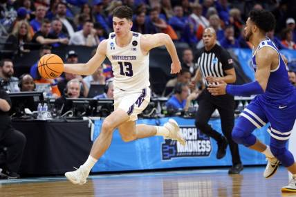 Mar 16, 2023; Sacramento, CA, USA; Northwestern Wildcats guard Brooks Barnhizer (13) controls the ball against Boise State Broncos guard Marcus Shaver Jr. (10) in the second half at Golden 1 Center. Mandatory Credit: Kelley L Cox-USA TODAY Sports