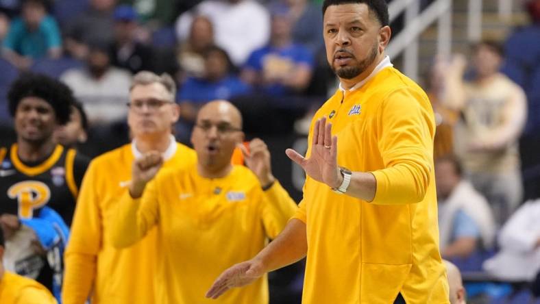 Mar 17, 2023; Greensboro, NC, USA; Pittsburgh Panthers head coach Jeff Capel III (right) gestures during the second half against the Iowa State Cyclones at Greensboro Coliseum. Mandatory Credit: Bob Donnan-USA TODAY Sports