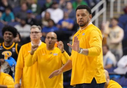 Mar 17, 2023; Greensboro, NC, USA; Pittsburgh Panthers head coach Jeff Capel III (right) gestures during the second half against the Iowa State Cyclones at Greensboro Coliseum. Mandatory Credit: Bob Donnan-USA TODAY Sports