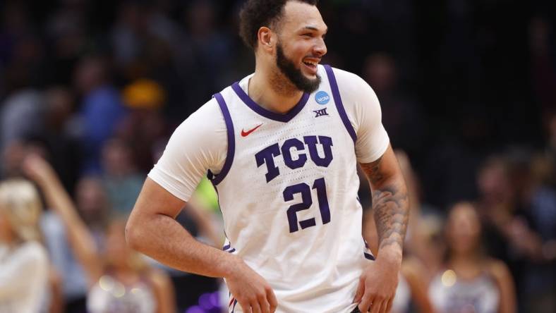 Mar 17, 2023; Denver, CO, USA; TCU Horned Frogs forward JaKobe Coles (21) reacts after defeating the Arizona State Sun Devils in the first round of the NCAA tournament at Ball Arena. Mandatory Credit: Michael Ciaglo-USA TODAY Sports