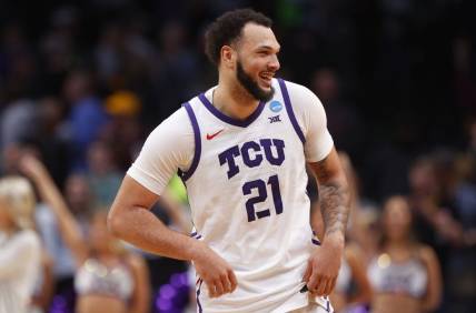 Mar 17, 2023; Denver, CO, USA; TCU Horned Frogs forward JaKobe Coles (21) reacts after defeating the Arizona State Sun Devils in the first round of the NCAA tournament at Ball Arena. Mandatory Credit: Michael Ciaglo-USA TODAY Sports