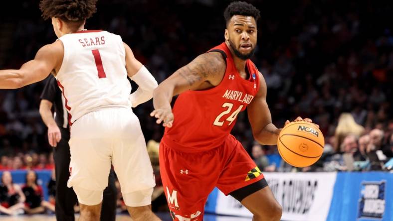 Mar 18, 2023; Birmingham, AL, USA; Maryland Terrapins forward Donta Scott (24) drives past Alabama Crimson Tide guard Mark Sears (1) during the first half at Legacy Arena. Mandatory Credit: Vasha Hunt-USA TODAY Sports