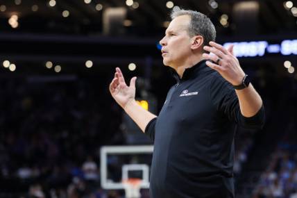 Mar 18, 2023; Sacramento, CA, USA; Northwestern Wildcats head coach Chris Collins reacts during the second half against the UCLA Bruins at Golden 1 Center. Mandatory Credit: Kelley L Cox-USA TODAY Sports