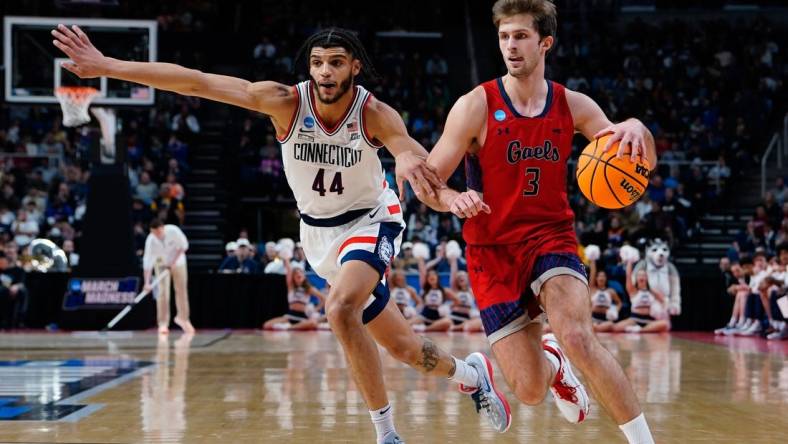 Mar 19, 2023; Albany, NY, USA; Saint Mary's Gaels guard Augustas Marciulionis (3) dribbles the ball against Connecticut Huskies guard Andre Jackson Jr. (44) during the second half at MVP Arena. Mandatory Credit: Gregory Fisher-USA TODAY Sports