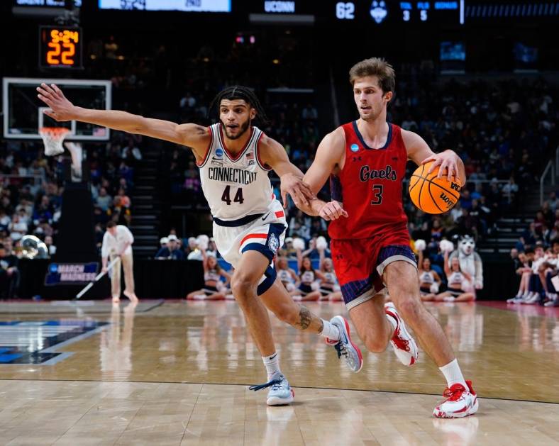 Mar 19, 2023; Albany, NY, USA; Saint Mary's Gaels guard Augustas Marciulionis (3) dribbles the ball against Connecticut Huskies guard Andre Jackson Jr. (44) during the second half at MVP Arena. Mandatory Credit: Gregory Fisher-USA TODAY Sports