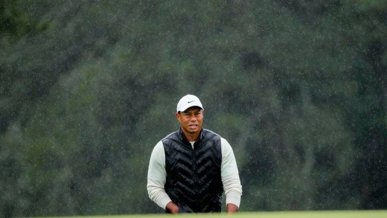 Tiger Woods lines up his putt on the 18th green during the second round of the Masters.

Pga Masters Tournament Completion Of Second Round