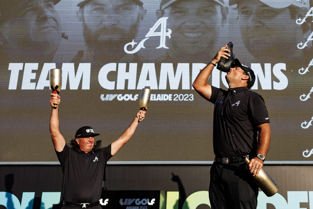 Apr 23, 2023; Adelaide, South Australia, AUS; Team Aces (Pat Perez, Dustin Johnson, Peter Uihlein) celebrate their victory in the team competition, following the final round of LIV Golf Adelaide golf tournament at Grange Golf Club. Mandatory Credit: Mike Frey-USA TODAY Sports