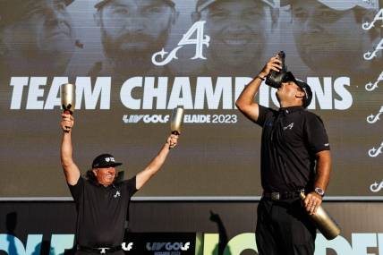 Apr 23, 2023; Adelaide, South Australia, AUS; Team Aces (Pat Perez, Dustin Johnson, Peter Uihlein) celebrate their victory in the team competition, following the final round of LIV Golf Adelaide golf tournament at Grange Golf Club. Mandatory Credit: Mike Frey-USA TODAY Sports