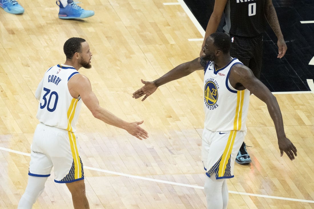April 30, 2023; Sacramento, California, USA; Golden State Warriors guard Stephen Curry (30) celebrates with forward Draymond Green (23) during the fourth quarter in game seven of the 2023 NBA playoffs first round against the Sacramento Kings at Golden 1 Center. Mandatory Credit: Kyle Terada-USA TODAY Sports