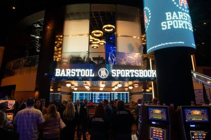 People line up in front of Barstool Sportsbook within Hollywood Casino at Kansas Speedway before the official start of legal sports betting on Sept. 1, 2022.