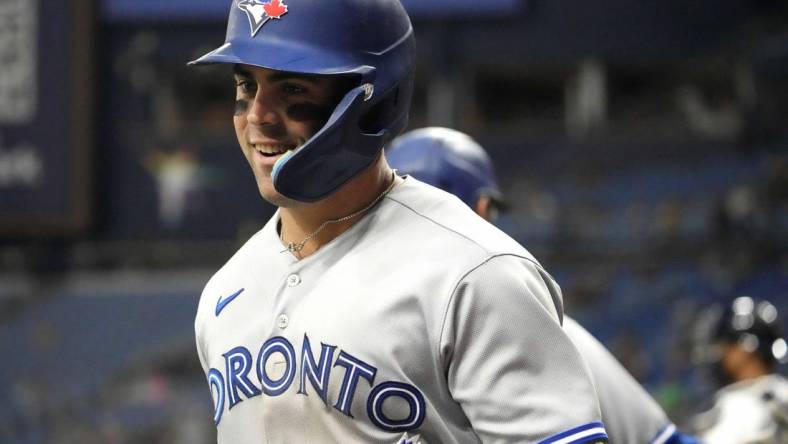 May 22, 2023; St. Petersburg, Florida, USA; Toronto Blue Jays left fielder Whit Merrifield (15) reacts after hitting a home run against the Tampa Bay Rays during the fourth inning at Tropicana Field. Mandatory Credit: Dave Nelson-USA TODAY Sports