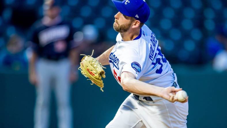 Oklahoma City Dodgers pitcher Adam Kolarek (56) pitches during a Minor League Baseball game between the Oklahoma City Dodgers and the Las Vegas Aviators at Chickasaw Bricktown Ballpark in Oklahoma City on Wednesday, June 21, 2023.