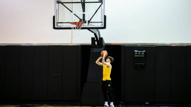 Iowa guard Brock Harding warms up before a summer practice at Carver-Hawkeye Arena in Iowa City, Iowa.