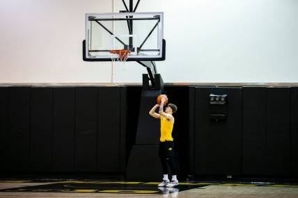 Iowa guard Brock Harding warms up before a summer practice at Carver-Hawkeye Arena in Iowa City, Iowa.