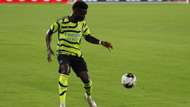 Jul 19, 2023; Washington, DC, USA; Arsenal midfielder Bukayo Saka (7) dribbles the ball against MLS All-Stars in the 2023 MLS All Star Game at Audi Field. Mandatory Credit: Geoff Burke-USA TODAY Sports