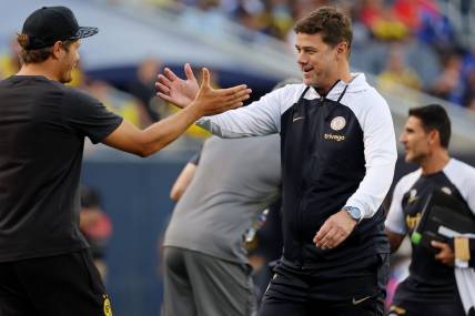Aug 2, 2023; Chicago, Illinois, USA; Borussia Dortmund manager Edin Terzic (left) shakes hands with Chelsea manager Mauricio Pochettino (right) before the game at Soldier Field. Mandatory Credit: Jon Durr-USA TODAY Sports