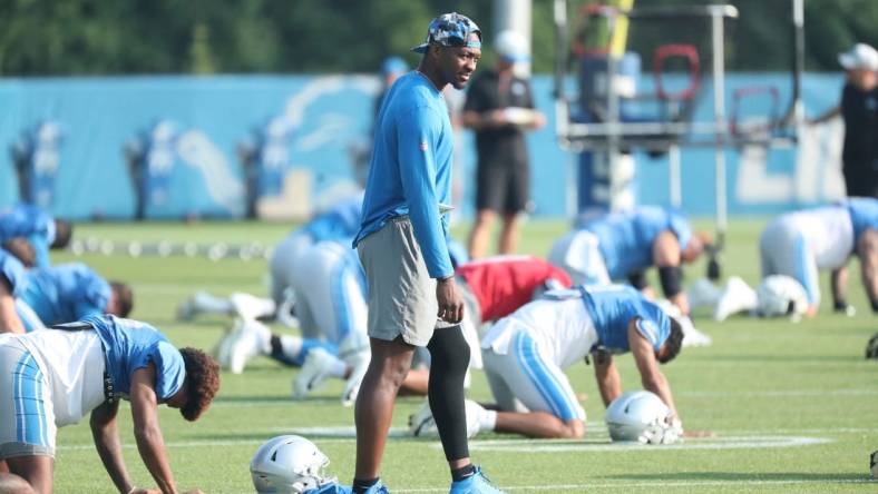 Lions quarterback Hendon Hooker watches players stretch during training camp on Thursday, Aug. 3, 2023, in Allen Park.