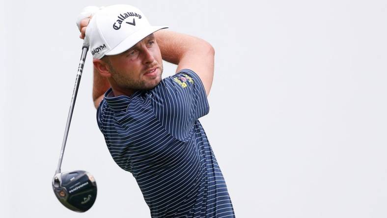 PGA Tour player Adam Svensson tees off at the first hole during the third round of the FedEx St. Jude Championship at TPC Southwind in Memphis, Tenn., on Saturday, August 12, 2023.