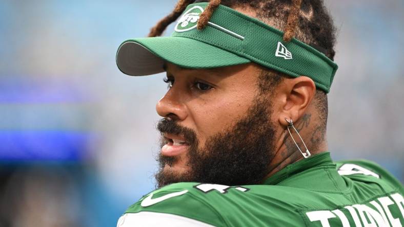 Aug 12, 2023; Charlotte, North Carolina, USA; New York Jets offensive tackle Billy Turner (54) on the sidelines in the fourth quarter at Bank of America Stadium. Mandatory Credit: Bob Donnan-USA TODAY Sports