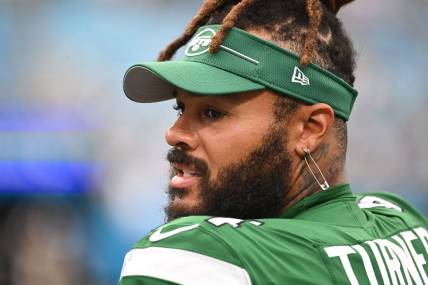 Aug 12, 2023; Charlotte, North Carolina, USA; New York Jets offensive tackle Billy Turner (54) on the sidelines in the fourth quarter at Bank of America Stadium. Mandatory Credit: Bob Donnan-USA TODAY Sports