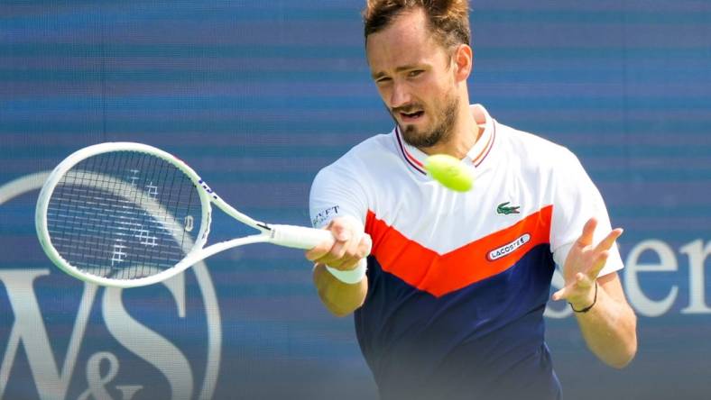 Daniil Medvedev, of Russia, hits a forehand to Lorenzo Musetti, of Italy, during the Western & Southern Open at the Lindner Family Tennis Center in Mason on Wednesday, Aug. 16, 2023. Medvedev won 6-3, 6-2.