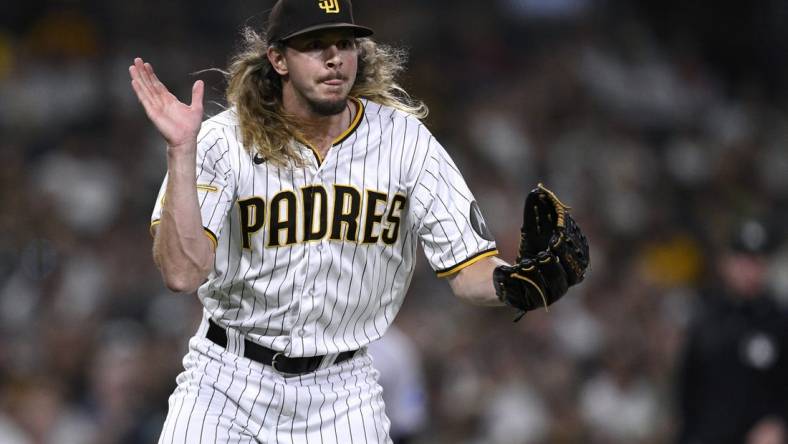 Aug 22, 2023; San Diego, California, USA; San Diego Padres relief pitcher Scott Barlow (58) reacts during the seventh inning against the Miami Marlins at Petco Park. Mandatory Credit: Orlando Ramirez-USA TODAY Sports