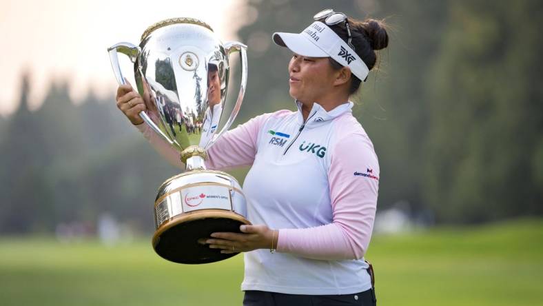 Aug 27, 2023; Vancouver, British Columbia, CAN; Megan Khang holds the championship trophy after the final round of the CPKC Women's Open golf tournament at Shaughnessy Golf & Country Club. Mandatory Credit: Bob Frid-USA TODAY Sports