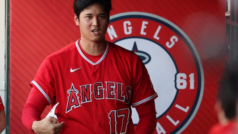 Aug 22, 2023; Anaheim, California, USA;  Los Angeles Angels designated hitter Shohei Ohtani (17) in the dugout during the MLB game against the Cincinnati Reds at Angel Stadium. Mandatory Credit: Kiyoshi Mio-USA TODAY Sports