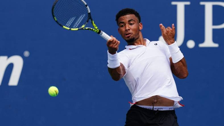 Aug 29, 2023; Flushing, NY, USA;  Arthur Fils of France hits a shot against Tallon Griekspoor of Netherlands on day two of the 2023 U.S. Open tennis tournament at the USTA Billie Jean King National Tennis Center. Mandatory Credit: Jerry Lai-USA TODAY Sports