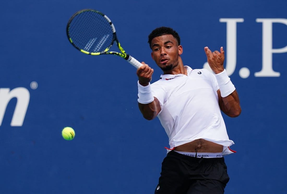 Aug 29, 2023; Flushing, NY, USA;  Arthur Fils of France hits a shot against Tallon Griekspoor of Netherlands on day two of the 2023 U.S. Open tennis tournament at the USTA Billie Jean King National Tennis Center. Mandatory Credit: Jerry Lai-USA TODAY Sports