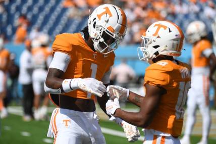 Sep 2, 2023; Nashville, Tennessee, USA; Tennessee Volunteers wide receiver Dont'e Thornton Jr. (1) and wide receiver Squirrel White (10) before the game against the Virginia Cavaliers at Nissan Stadium. Mandatory Credit: Christopher Hanewinckel-USA TODAY Sports