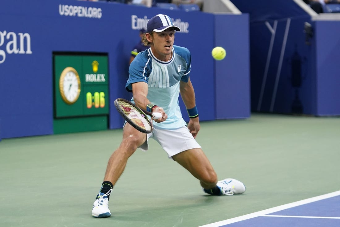 Sep 4, 2023; Flushing, NY, USA; Alex de Minaur of Australia hits to Daniil Medvedev on day eight of the 2023 U.S. Open tennis tournament at USTA Billie Jean King National Tennis Center. Mandatory Credit: Danielle Parhizkaran-USA TODAY Sports