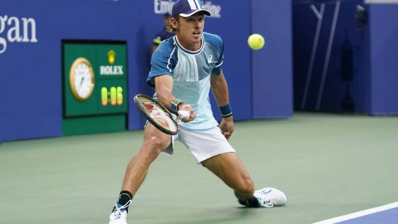 Sep 4, 2023; Flushing, NY, USA; Alex de Minaur of Australia hits to Daniil Medvedev on day eight of the 2023 U.S. Open tennis tournament at USTA Billie Jean King National Tennis Center. Mandatory Credit: Danielle Parhizkaran-USA TODAY Sports