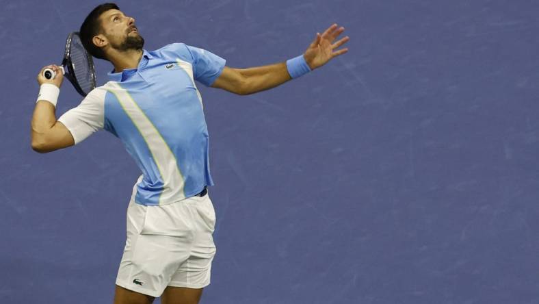 Sep 8, 2023; Flushing, NY, USA; Novak Djokovic of Serbia serves against Ben Shelton of the United States (not pictured) in a men's singles semifinal on day twelve of the 2023 U.S. Open tennis tournament at USTA Billie Jean King Tennis Center. Mandatory Credit: Geoff Burke-USA TODAY Sports