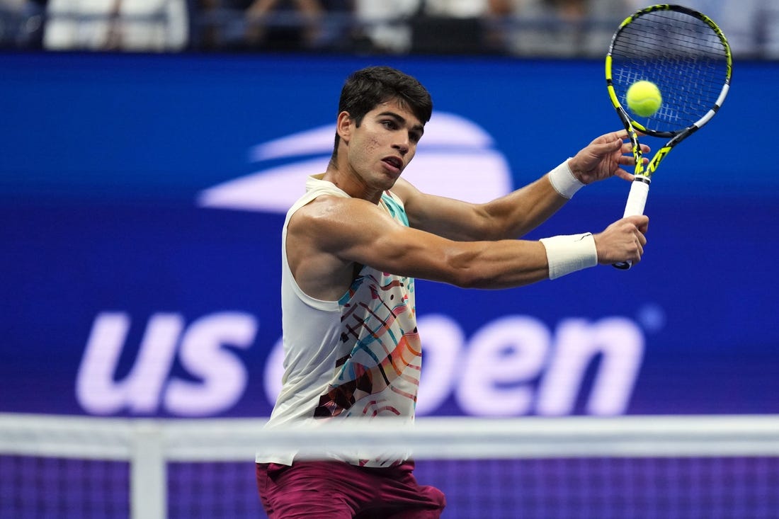 Sep 8, 2023; Flushing, NY, USA; Carlos Alcaraz of Spain hits to Daniil Medvedev in a men's singles semifinal on day twelve of the 2023 U.S. Open tennis tournament at USTA Billie Jean King Tennis Center. Mandatory Credit: Danielle Parhizkaran-USA TODAY Sports