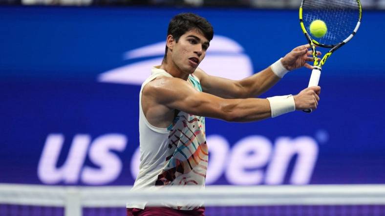 Sep 8, 2023; Flushing, NY, USA; Carlos Alcaraz of Spain hits to Daniil Medvedev in a men's singles semifinal on day twelve of the 2023 U.S. Open tennis tournament at USTA Billie Jean King Tennis Center. Mandatory Credit: Danielle Parhizkaran-USA TODAY Sports