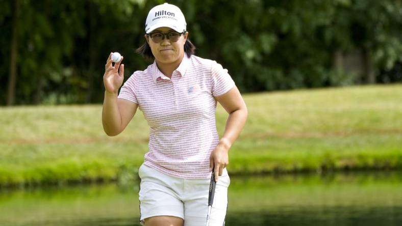 Sep 9, 2023; Cincinnati, Ohio, USA; Nasa Hataoka, of Ibaraki, Japan, waves to the crowd after making her putt for birdie on the 12th hole at the 2023 Kroger Queen City Championship presented by P&G at Kenwood Country Club in Madeira, Ohio. Mandatory Credit: Carter Skaggs-USA TODAY Sports